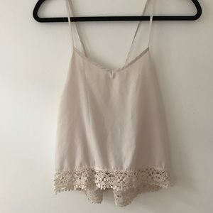 Adorable cream tank with crochet detail!